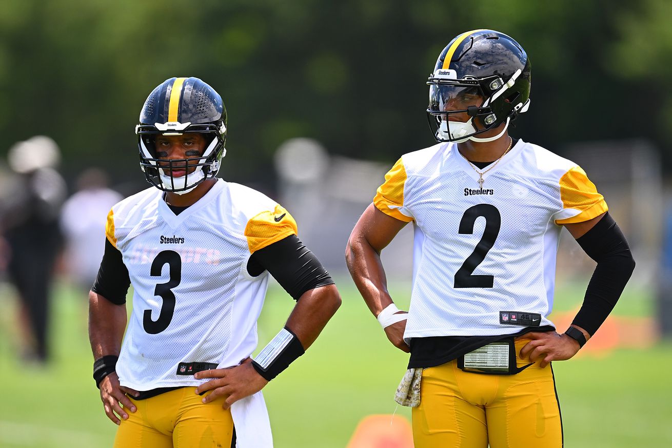 Russell Wilson #3 looks on alongside Justin Fields #2 of the Pittsburgh Steelers during the Pittsburgh Steelers OTA offseason workout at UPMC Rooney Sports Complex on June 6 2024 in Pittsburgh, Pennsylvania.