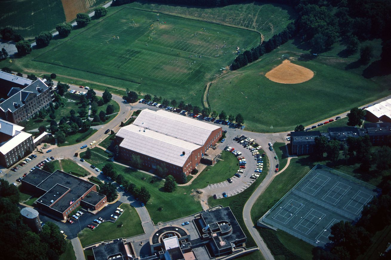Aerial view of the Pittsburgh Steelers as the team practices during summer training camp on a field (upper left) on the campus of Saint Vincent College in August 1984 in Latrobe, Pennsylvania.