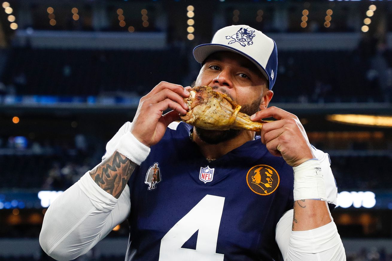 Dak Prescott #4 of the Dallas Cowboys takes a bite of a turkey leg in a post game interview following the game against the Washington Commanders at AT&amp;T Stadium on November 23, 2023 in Arlington, Texas.