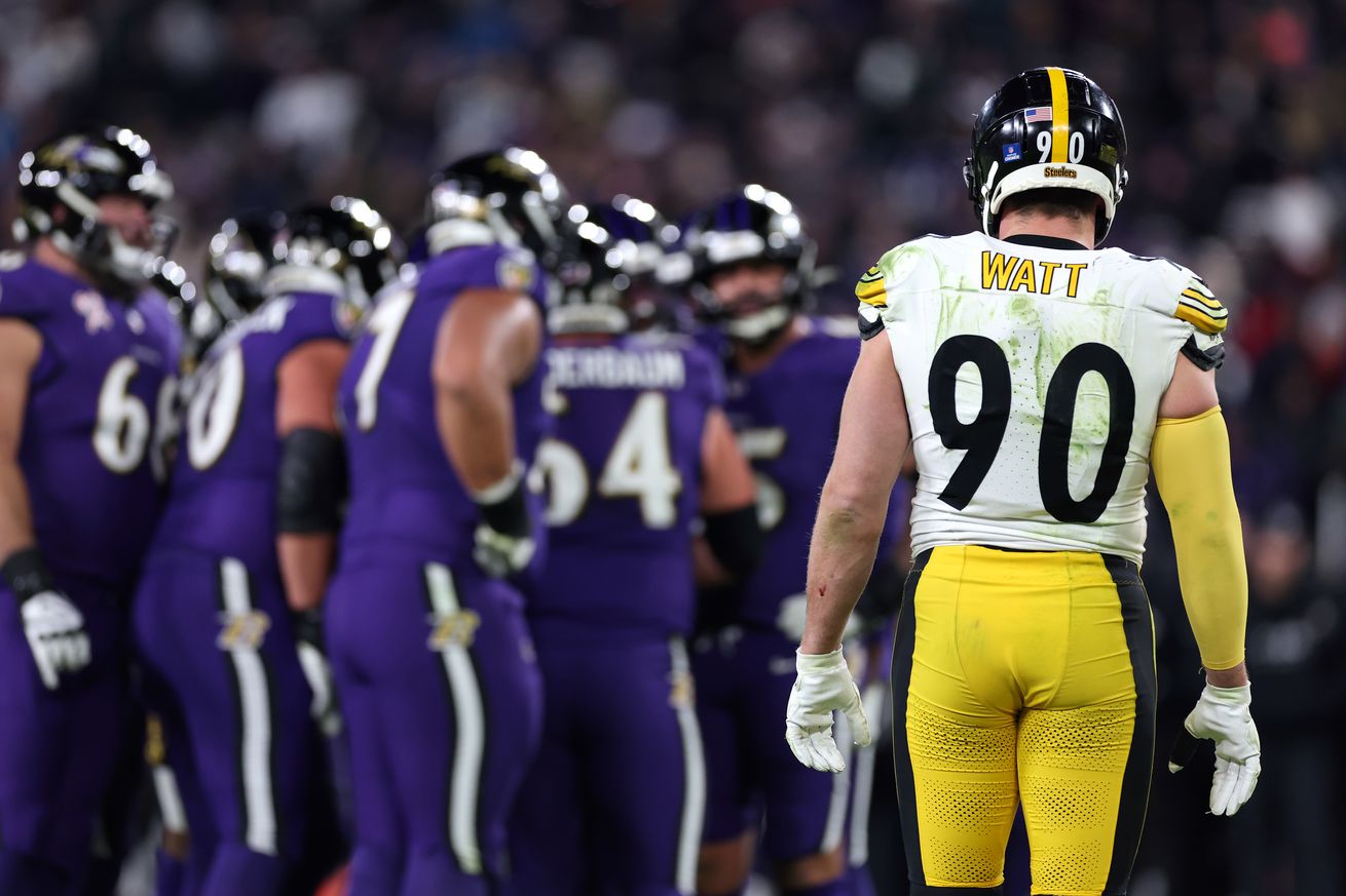 T.J. Watt #90 of the Pittsburgh Steelers looks on as the Baltimore Ravens huddle during the fourth quarter at M&amp;T Bank Stadium on December 21, 2024 in Baltimore, Maryland.