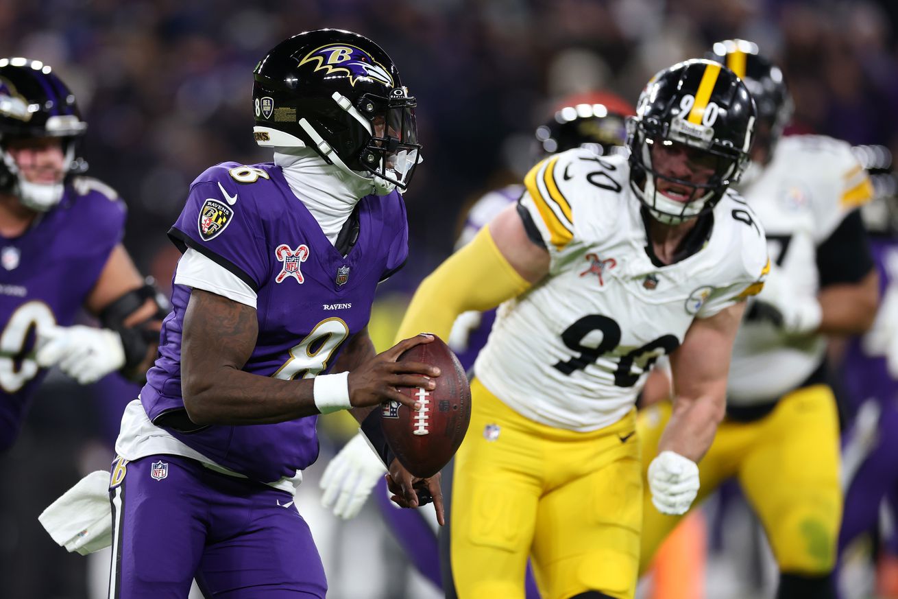 Lamar Jackson #8 of the Baltimore Ravens looks to pass while pressured bt T.J. Watt #90 of the Pittsburgh Steelers during the second quarter at M&amp;T Bank Stadium on December 21, 2024 in Baltimore, Maryland.