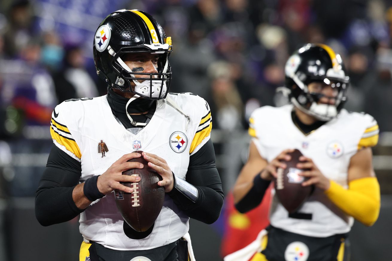 Russell Wilson #3 and Justin Fields #2 of the Pittsburgh Steelers warms up prior to the game against the Baltimore Ravens during the AFC Wild Card Playoff at M&amp;T Bank Stadium on January 11, 2025 in Baltimore, Maryland.