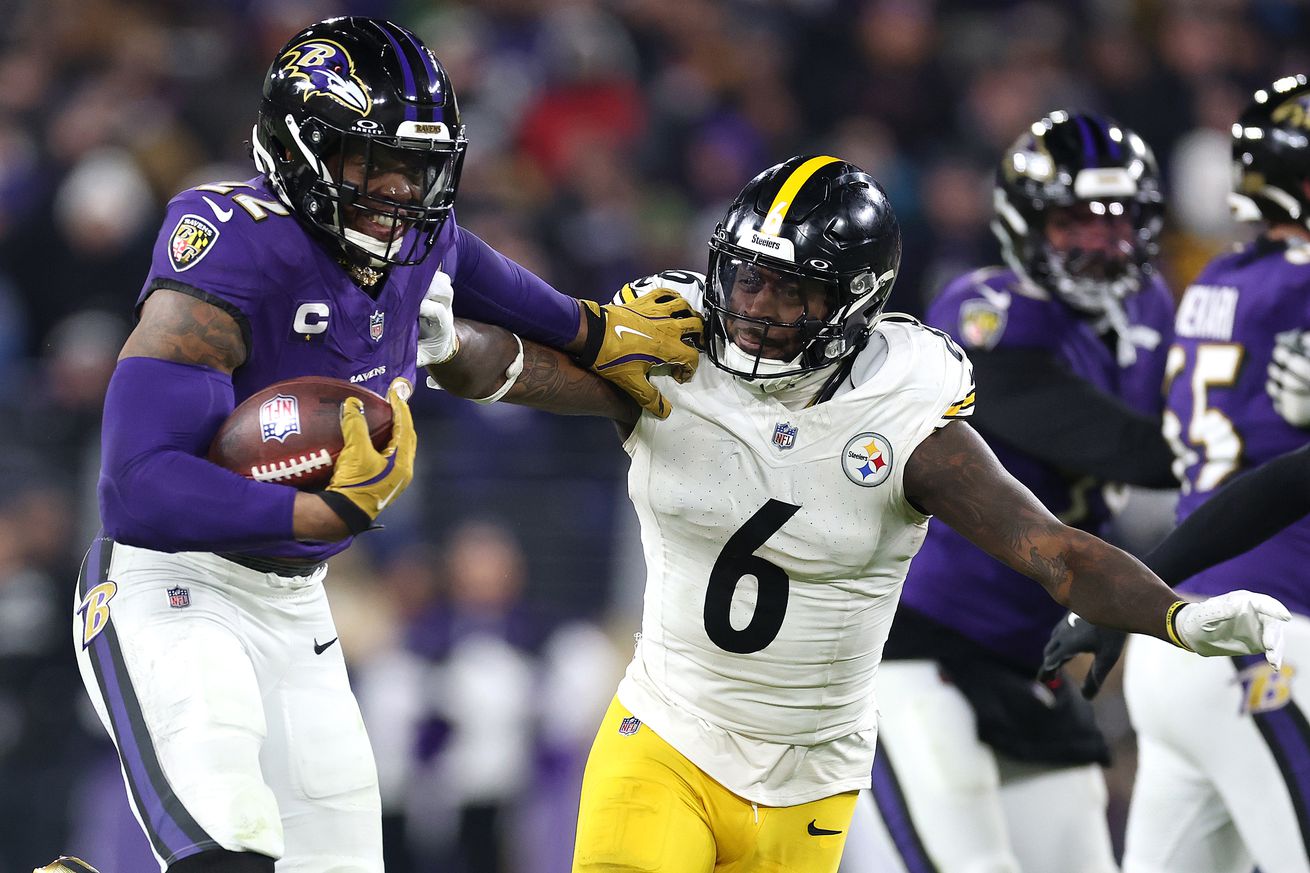 Derrick Henry #22 of the Baltimore Ravens runs the ball for a touchdown against Patrick Queen #6 of the Pittsburgh Steelers during the third quarter during the AFC Wild Card Playoff at M&amp;T Bank Stadium on January 11, 2025 in Baltimore, Maryland.