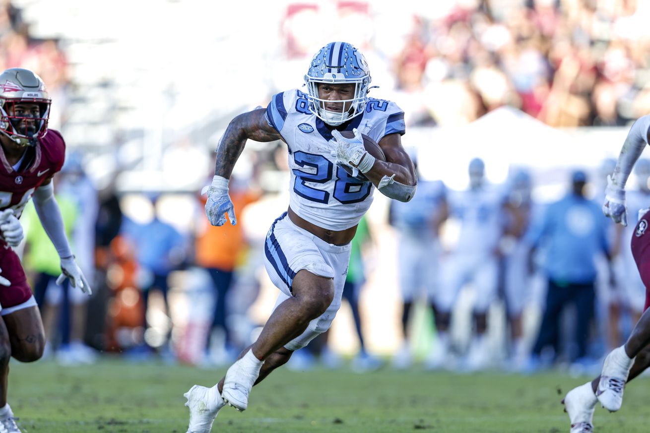 University of North Carolina running back, Omarion Hampton, carries for a touchdown as the Tar Heels face the Florida State Seminoles.