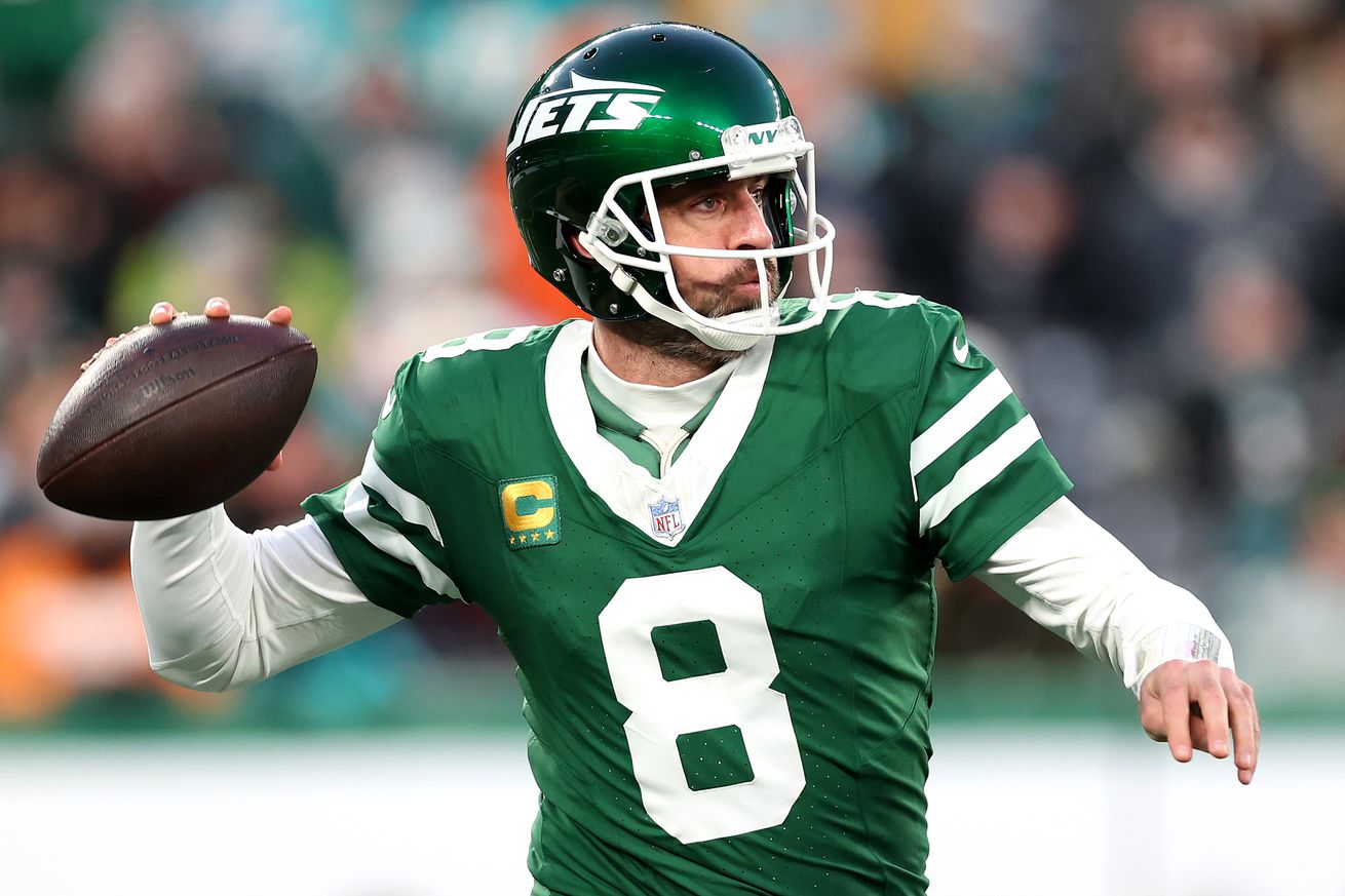 Aaron Rodgers #8 of the New York Jets in action against the Miami Dolphins at MetLife Stadium on January 05, 2025 in East Rutherford, New Jersey.