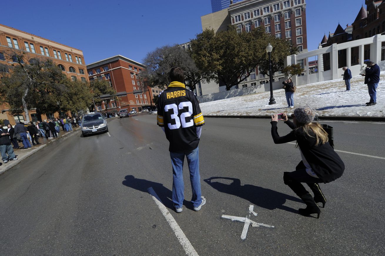 Football fans take pictures of the Texas