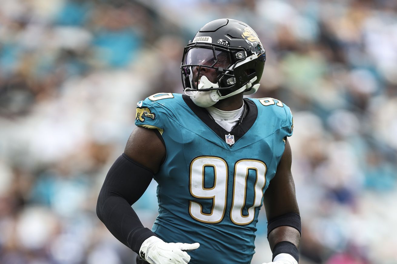 Esezi Otomewo #90 of the Jacksonville Jaguars runs across the field during an NFL football game against the Indianapolis Colts at EverBank Stadium on October 6, 2024 in Jacksonville, Florida.
