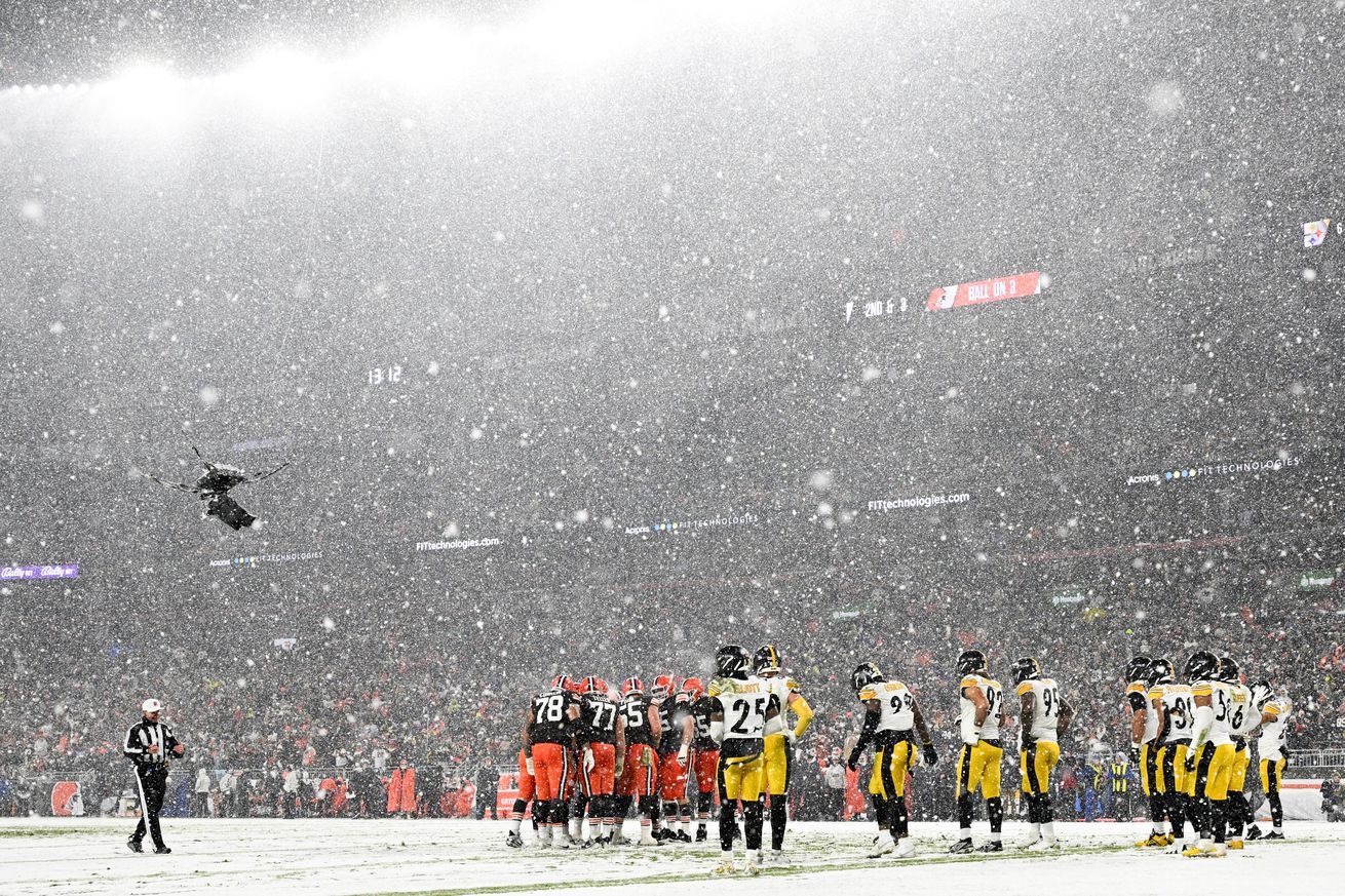Snow falls over the stadium during the fourth quarter between the Pittsburgh Steelers and the Cleveland Browns at Huntington Bank Field on November 21, 2024 in Cleveland, Ohio.