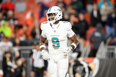 Jonnu Smith #9 of the Miami Dolphins celebrates scoring a 7-yard touchdown during the fourth quarter against the Cleveland Browns at Huntington Bank Field on December 29, 2024 in Cleveland, Ohio.