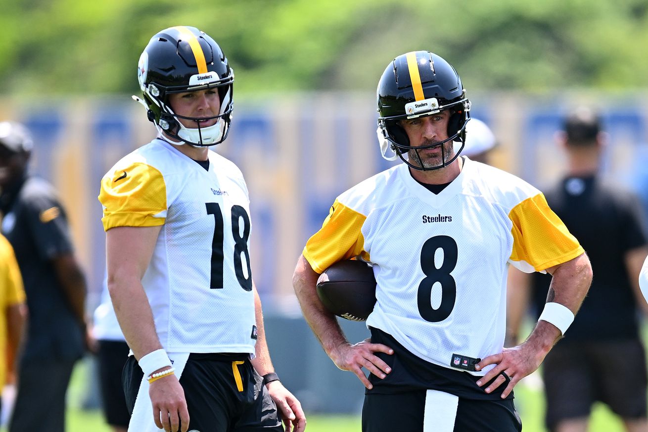 Will Howard #18 and Aaron Rodgers #8 of the Pittsburgh Steelers look on during Minicamp at UPMC Rooney Sports Complex on June 11, 2025 in Pittsburgh, Pennsylvania.
